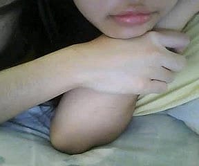 Chinese girl plays with tits